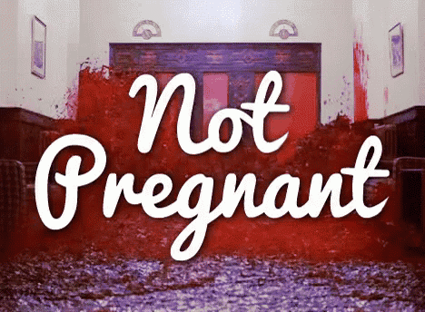 a sign that says " not pregnant " in front of a bloody room