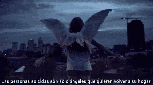 a person with angel wings is standing in front of a city skyline