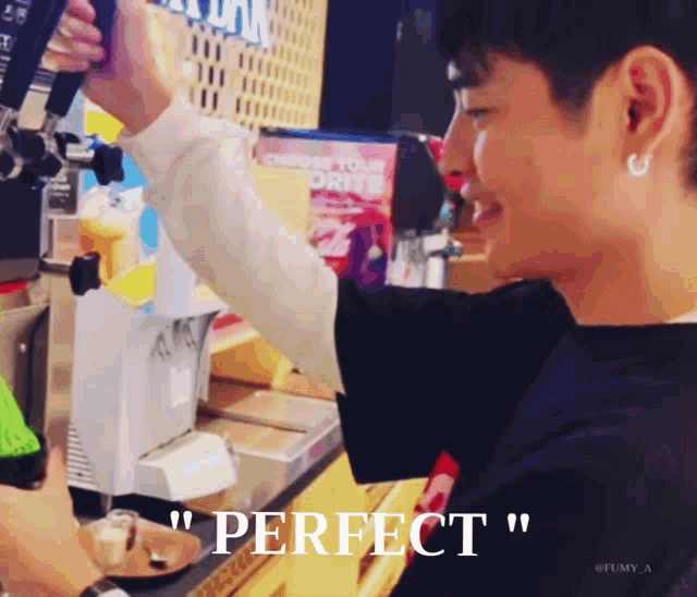 a man in a black shirt is pouring something into a glass with the word perfect below him