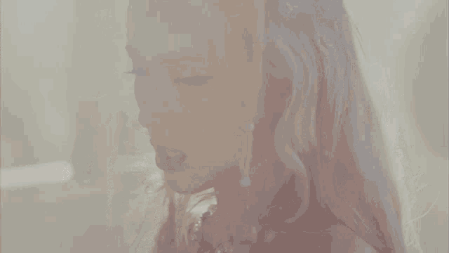a close up of a woman 's face with xoxo written in white