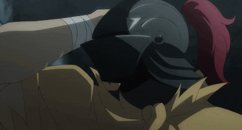 a person with a bandage on their arm holds a helmet over another person 's head