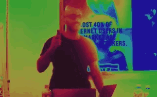 a man stands in front of a poster that says ost 40 % of ernet users in market makers