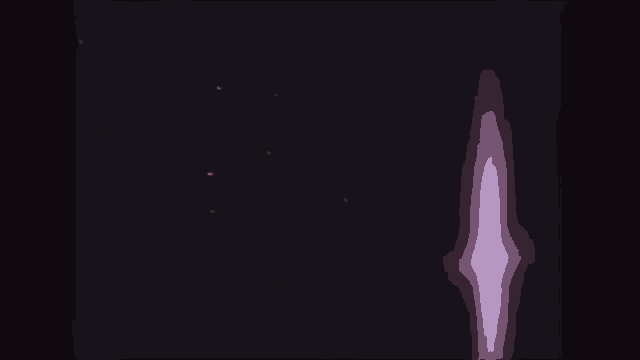 a purple light shines through a dark room
