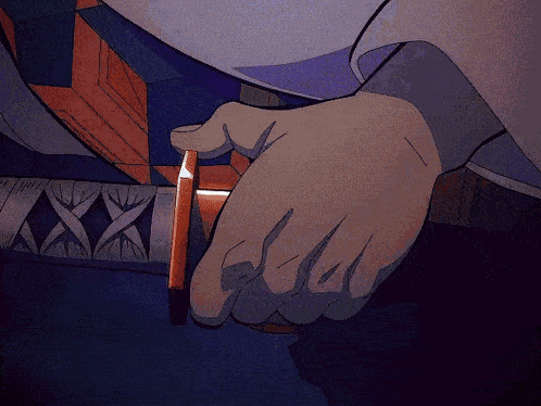 a person is holding a sword in their hand