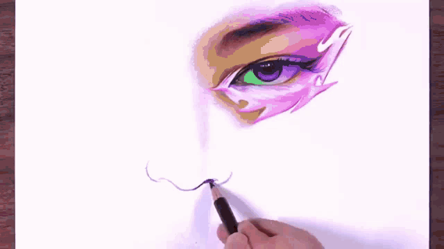 a person is drawing a colorful eye with a pencil