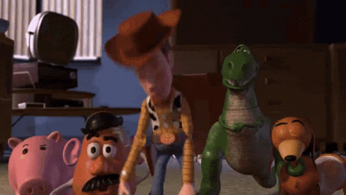 a group of toy story characters including woody mr potato head and rex