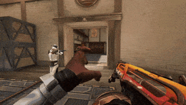a person holding a gun in front of a doorway