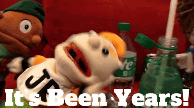 a sprite bottle is next to a puppet that says " it 's been years "
