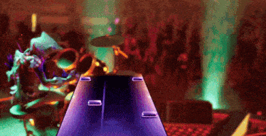 a video game shows a drummer playing drums in front of a crowd of people