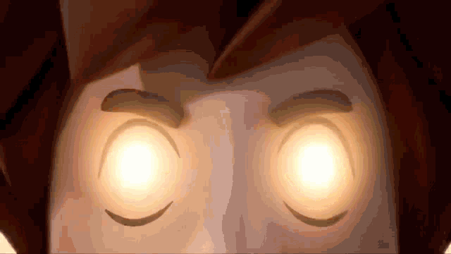 a close up of a cartoon character 's eyes with glowing eyes .