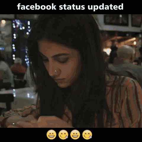 a woman is looking at her phone with a facebook status updated