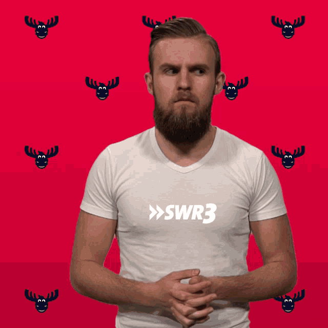 a man with a beard wears a white shirt that says swr3 on it