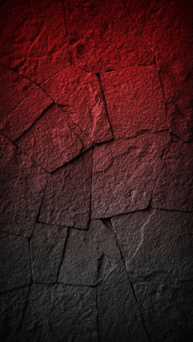 a red and black brick wall with a diagonal gradient