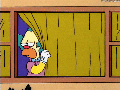 a cartoon of a clown looking out of a window with the caption simpsons-latino