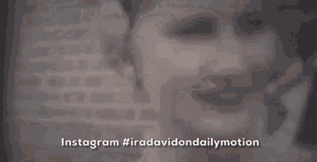a close up of a woman 's face with a blurred background and the words `` instagram #iradavidondailymotion '' .