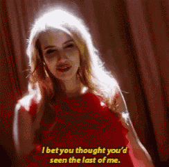 a woman in a red dress is saying `` i bet you thought you 'd seen the last of me ''