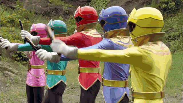 a group of power rangers are standing in a row