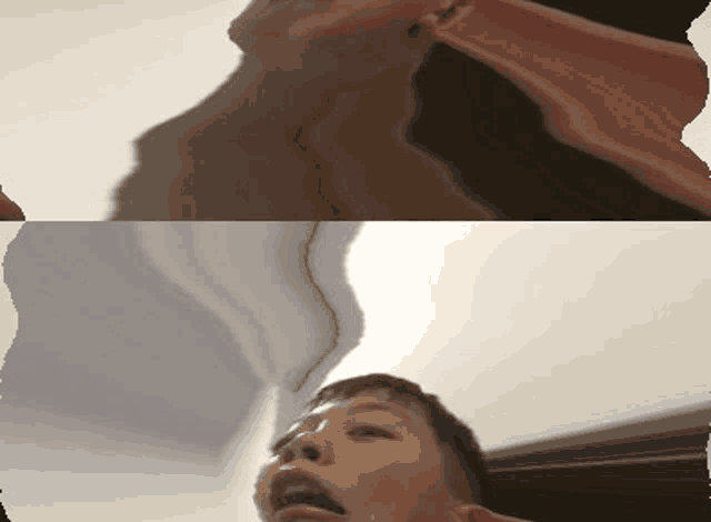 a close up of a person 's face with their mouth open and a blurry background
