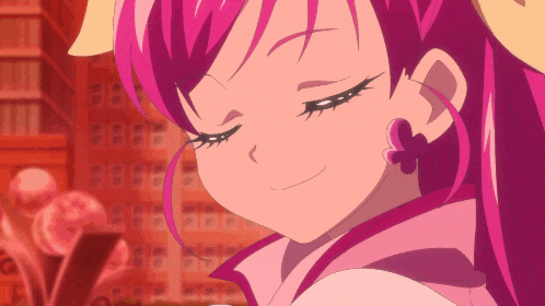 a close up of a pink haired anime girl with a butterfly earring