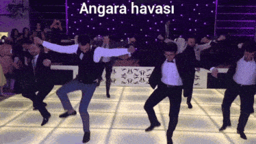 a group of men are dancing in front of a purple background that says angara havasi