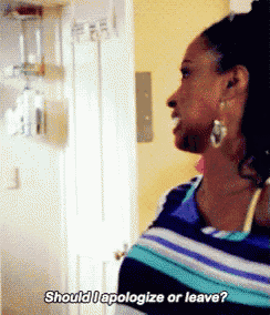 a woman in a striped shirt is saying should i apologize or leave ?