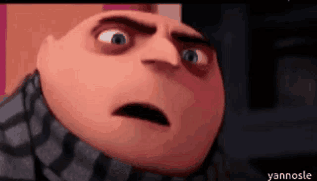 a close up of a cartoon character 's face with a very angry look on his face .
