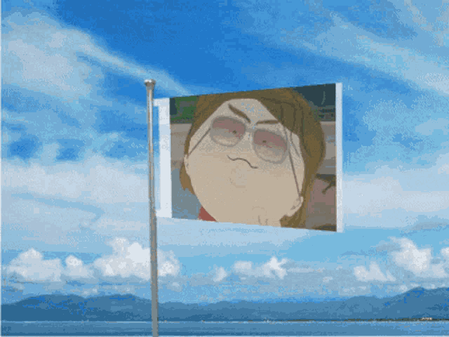 a flag with a picture of a man wearing sunglasses against a blue sky