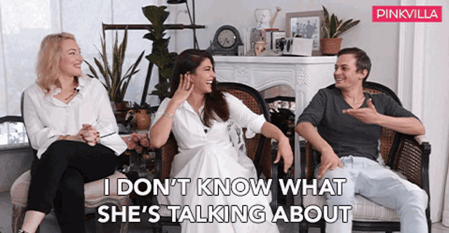 a pinkvilla ad with three people sitting in chairs