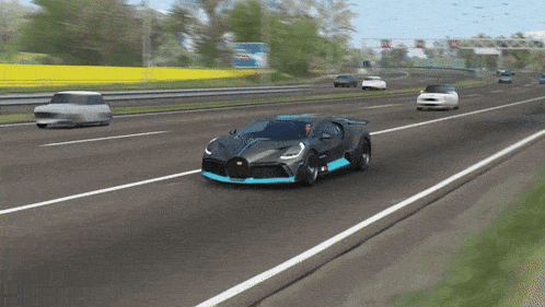 a bugatti car is driving down a highway next to a bottle of water