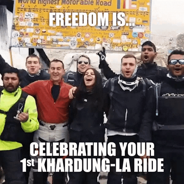a group of people standing in front of a sign that says freedom is celebrating your 1st khardung la ride