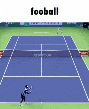 a tennis player is about to hit a tennis ball on a blue court