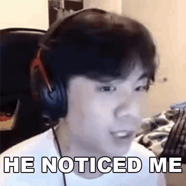 a man wearing headphones is saying `` he noticed me '' .