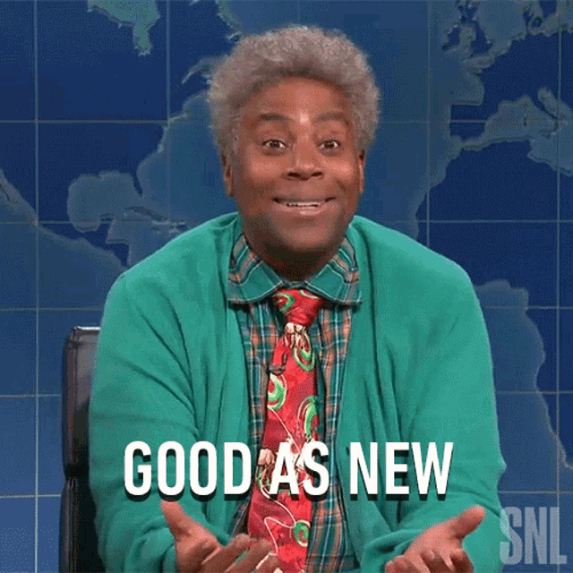 a man in a green sweater and tie is saying " good as new "