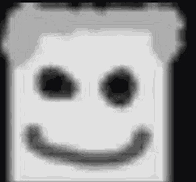 a marshmallow with a smiley face on it 's face .