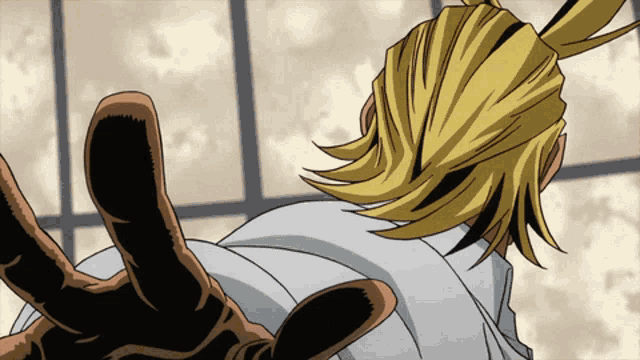 a close up of a person 's hand reaching out towards something