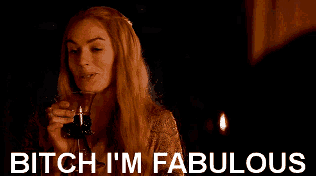 a woman holding a glass of wine with the words " bitch i 'm fabulous " below her