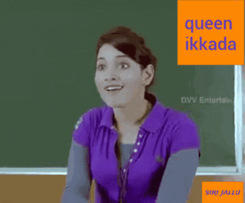 a woman in a purple shirt is sitting in front of a green board with the words queen ikkada on it .