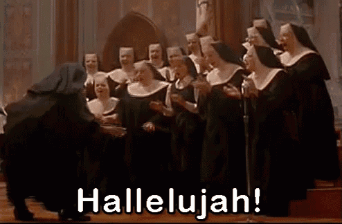 a group of nuns are singing in a church with the words hallelujah in the corner .