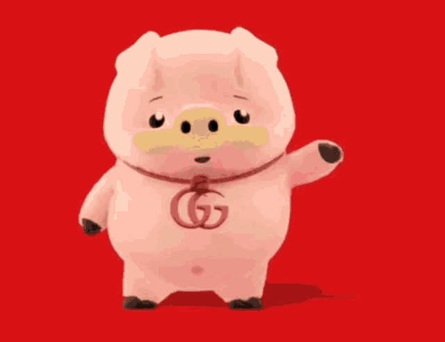 a stuffed pig with a g on its neck