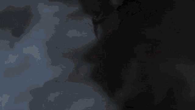a robot is flying through the air in a dark sky
