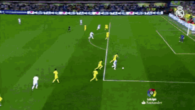 a soccer game is being played on a field with a bbva advertisement