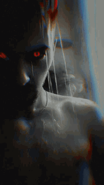 a blurry picture of a woman with red eyes