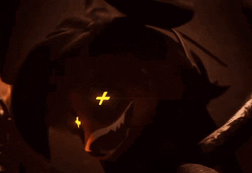 a close up of a person 's eyes with a cross in the middle