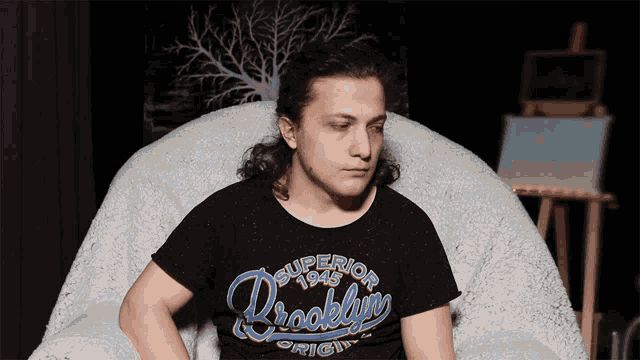 a man wearing a shirt that says superior brooklyn