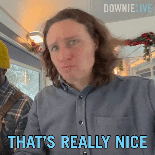 a man says that 's really nice in front of a downie live logo
