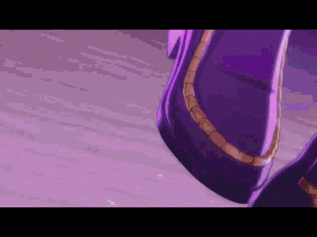 a close up of a person 's feet wearing purple pants
