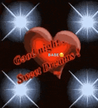 a heart with the words `` good night , sweet dreams '' written on it is surrounded by stars .