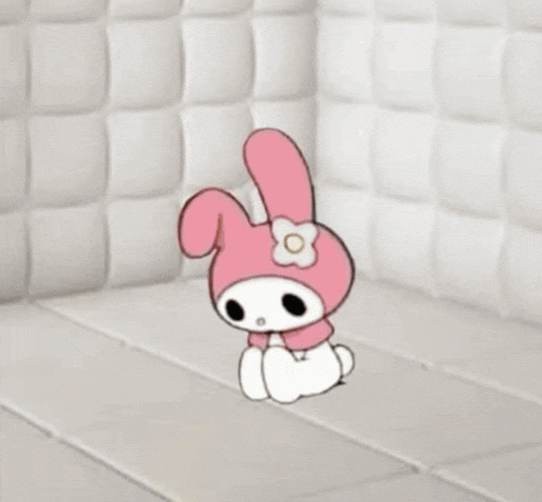a man in a white jacket is sitting on a white bed