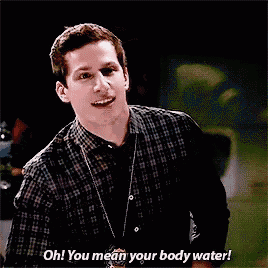 a man in a plaid shirt is talking to someone and says oh ! you mean your body water !