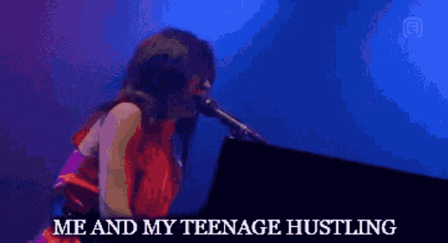 a woman singing into a microphone with the words " me and my teenage hustling " next to her